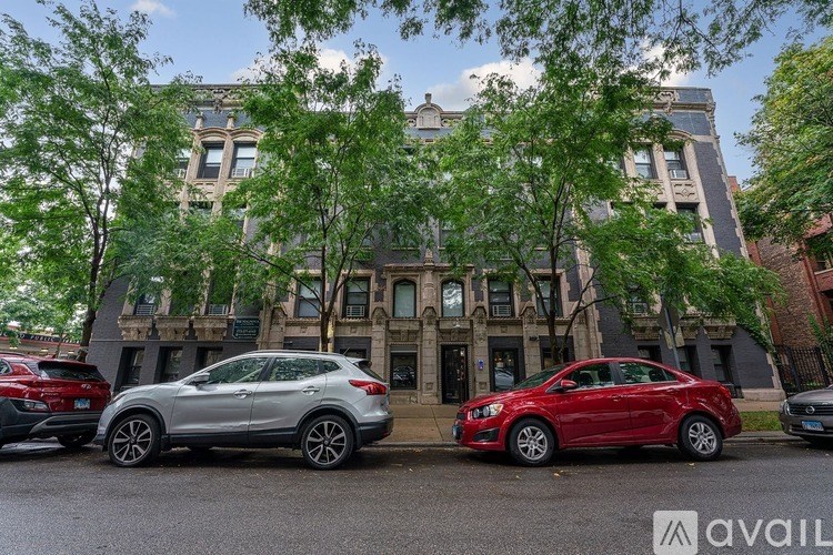 Two cars parked in front of a building with the Avail logo.