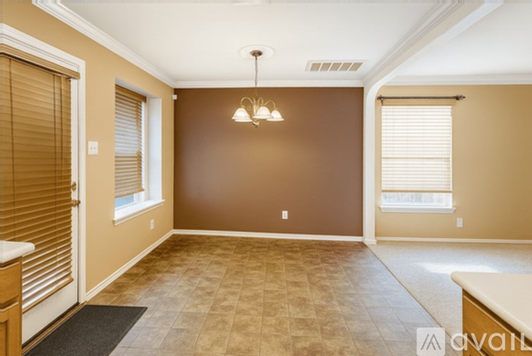 A room with brown walls and a tiled floor.