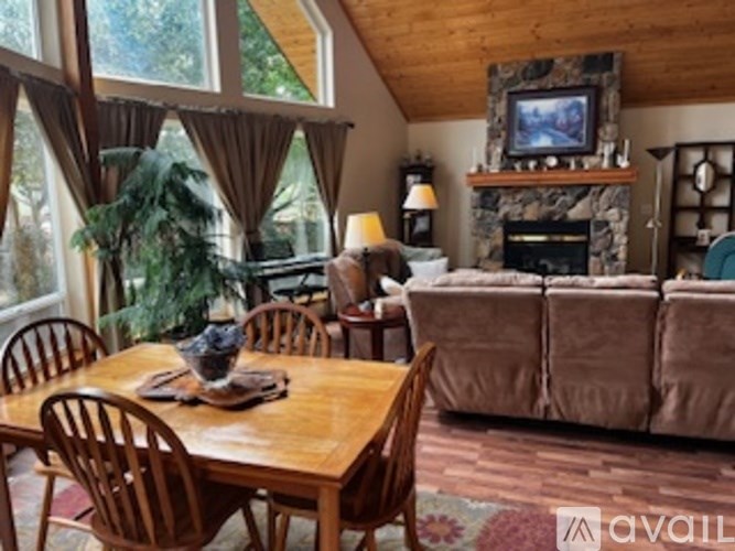 A living room with a fireplace and a couch.