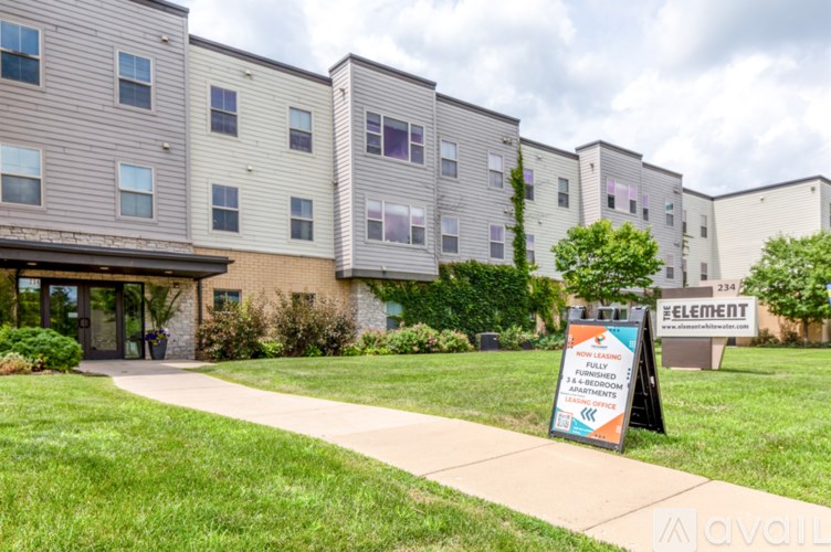 A sign in front of a building that says "Element".