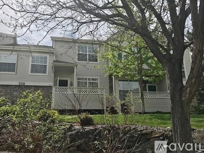 A two-story house with a balcony is for sale.