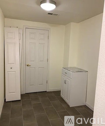 A small room with a washer and dryer in it.
