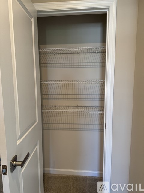 Empty white door with a silver handle.