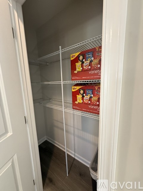 Empty white shelves in a white pantry.