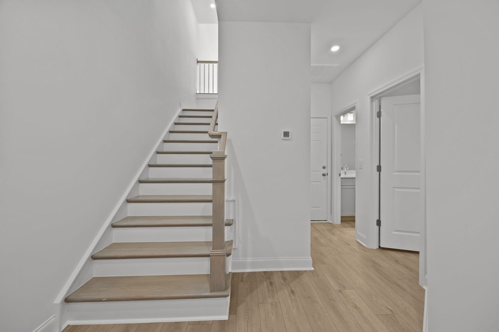A long staircase with wooden steps and handrails.