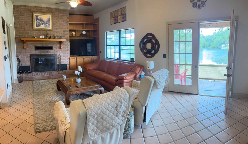 A living room with a fireplace and a couch.
