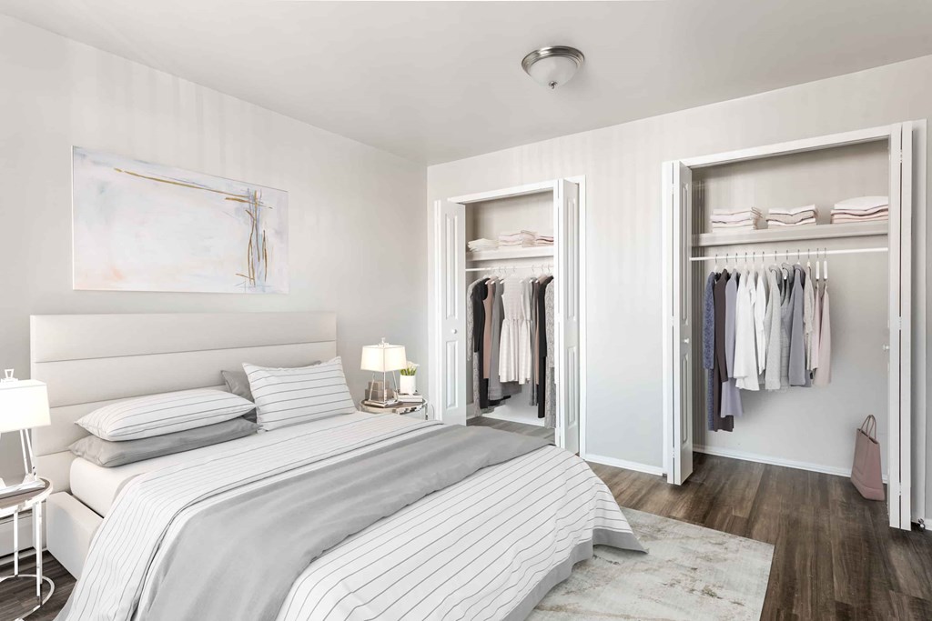 A bedroom with a large bed and a wardrobe.
