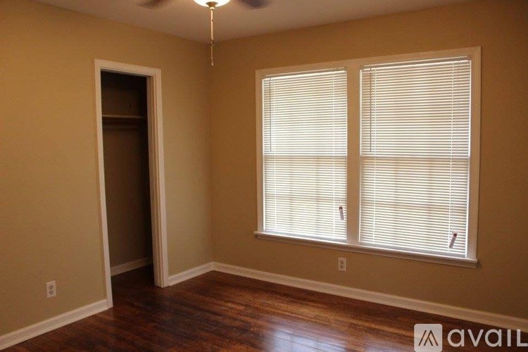 A room with a window and a door.