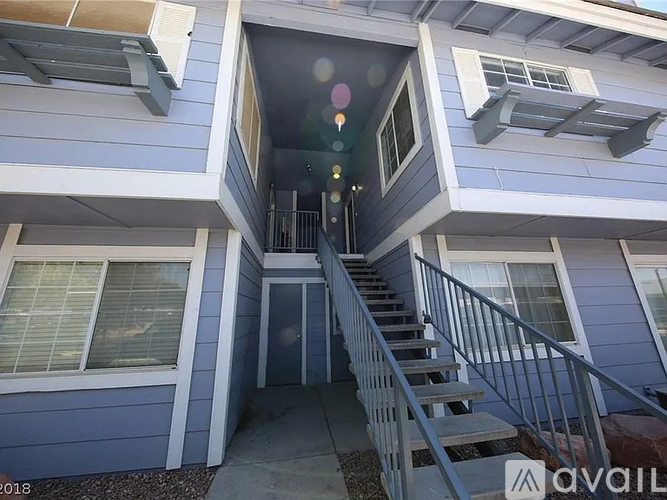 A house with a staircase leading to the second floor.