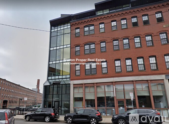 A building with the text "Boston Proper Real Estate" on it.