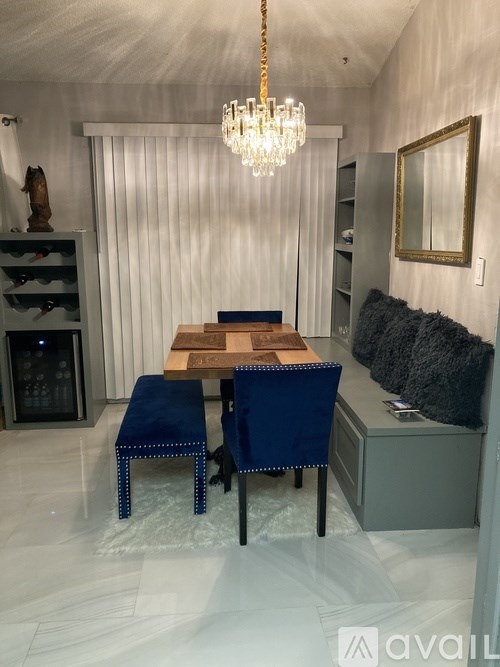 A dining area with a wooden table and blue chairs.