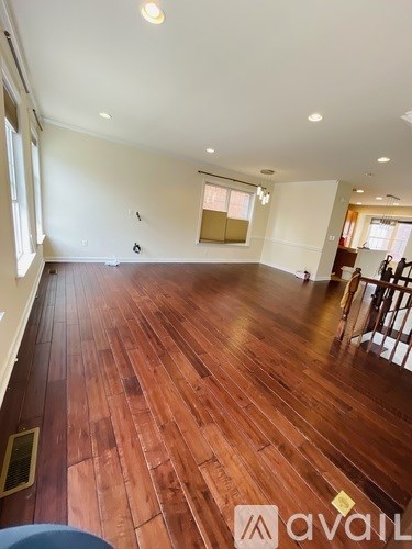 A room with wooden floors and a white ceiling.