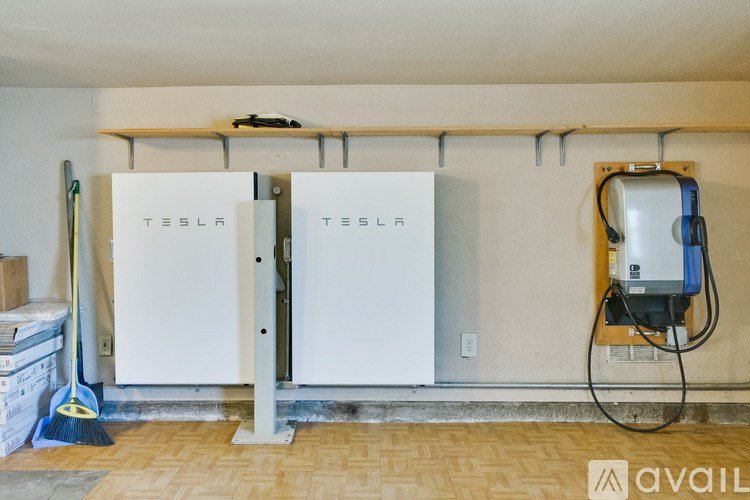 A Tesla power unit is installed in a room.