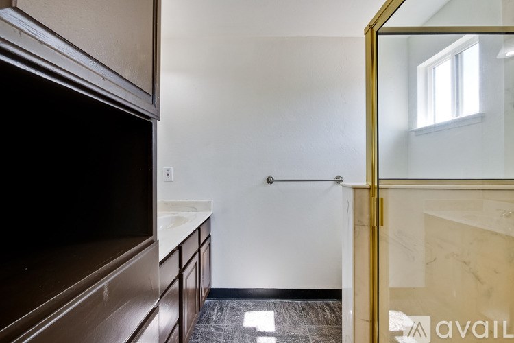 A bathroom with a sink and a mirror.