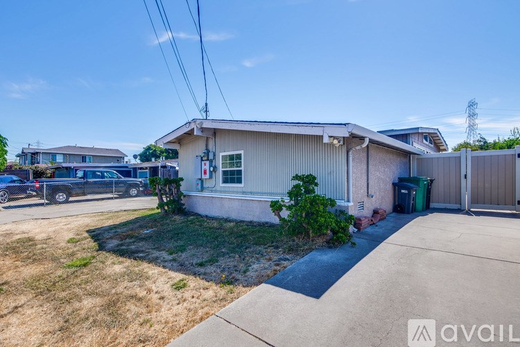 A house with a garage and a driveway is available for rent.