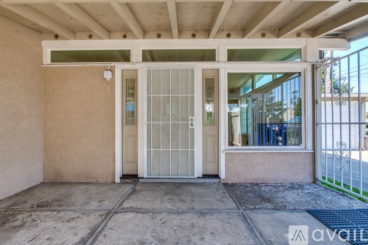 A white door with a glass window is the main focus of the image.
