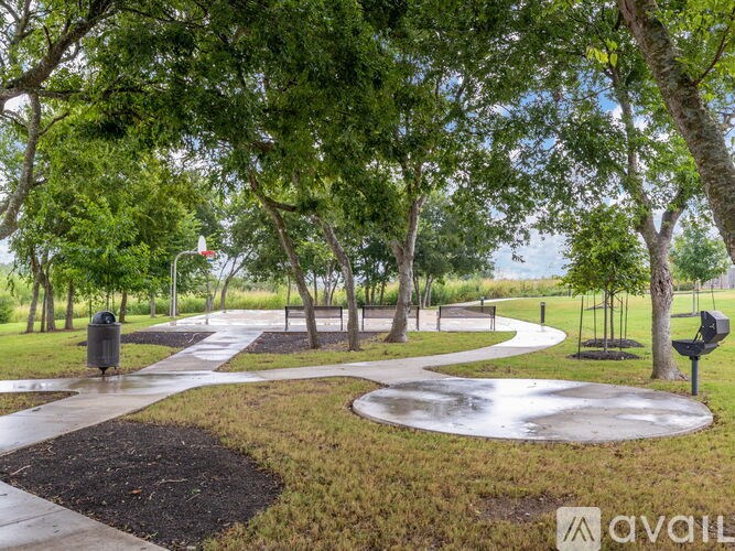 A park with a circular walkway and trees.