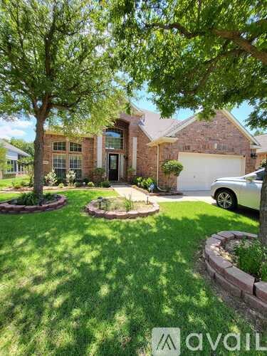 A house with a tree in front of it.