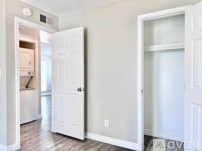 A white door is open to a hallway.