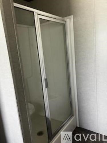 A white door with a glass panel is closed.