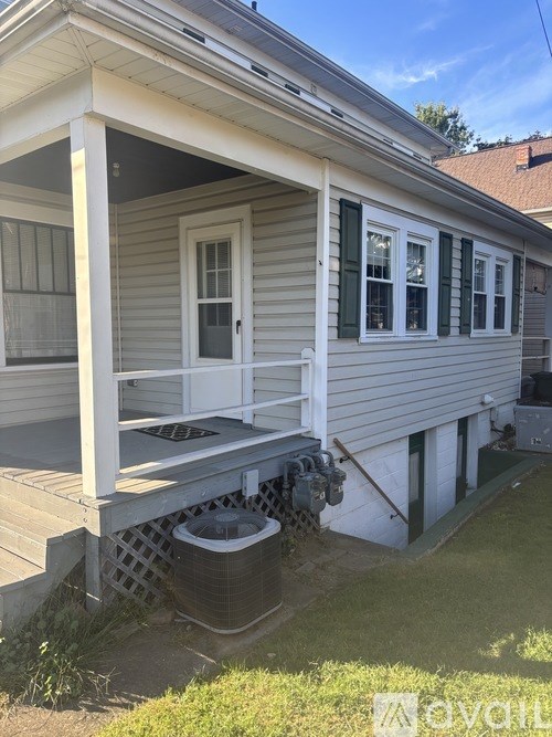 A house with a porch and a window.