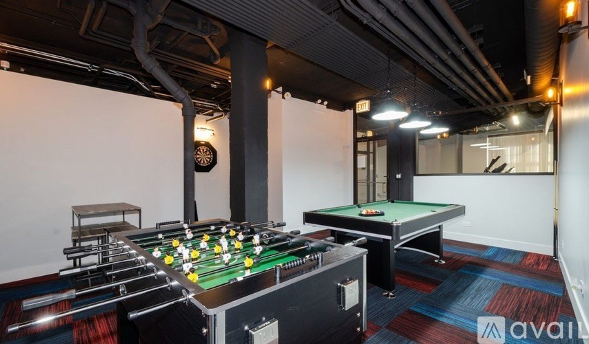 A pool table with a green felt cloth and white balls is in the center of the image.