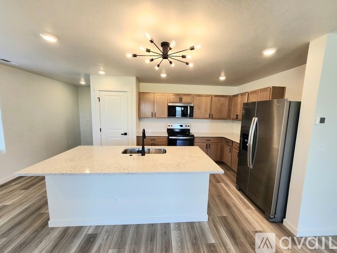 A two-story house with a garage is available for sale.