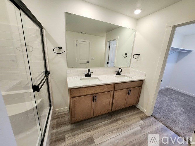 A small, empty room with a window and shelving units.