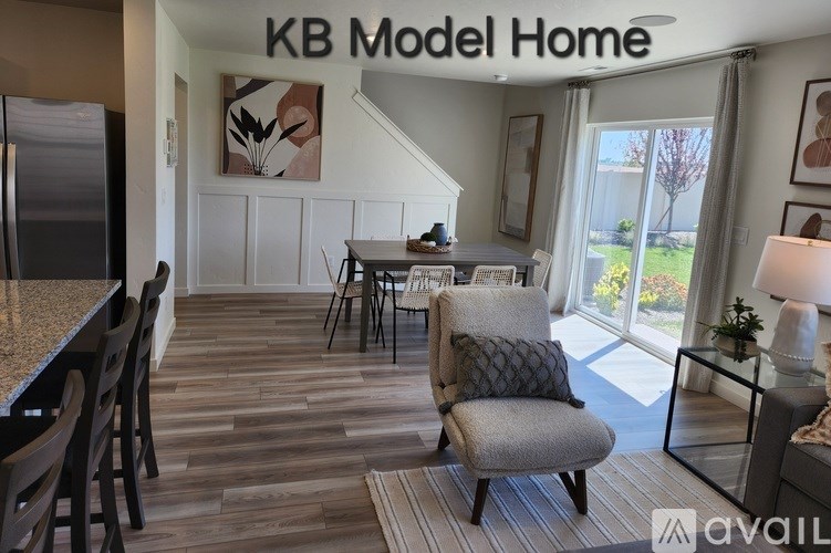 A kitchen area with a dining table and chairs.