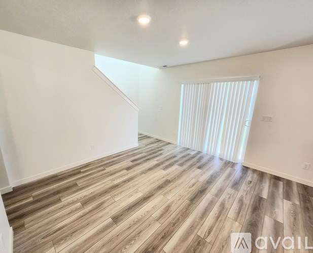 A bathroom with a toilet, sink, and mirror.