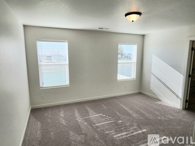 A bathroom with a vanity and a walk-in shower.