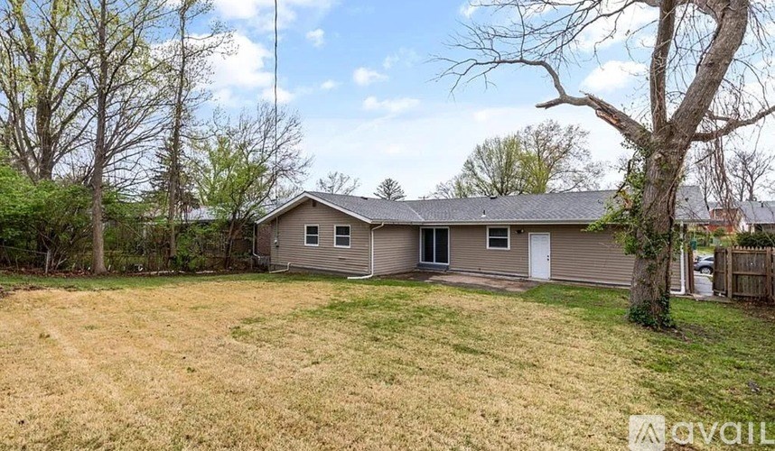 A house with a lawn in front of it is for sale.