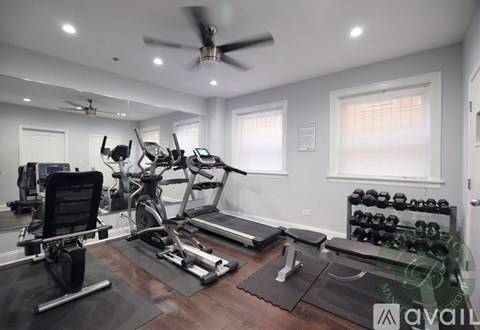 A well-equipped home gym with a variety of exercise equipment.