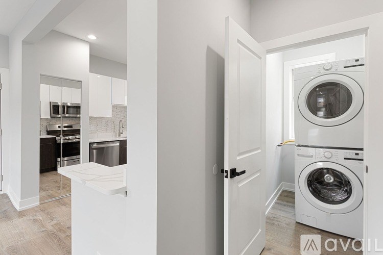 A modern laundry room with a washer and dryer.
