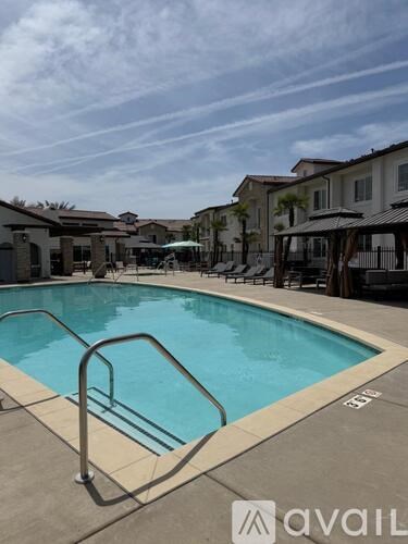 A pool with a metal ladder in the middle of it.