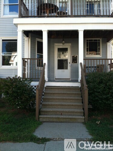 A house with a white door and a porch.