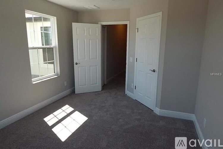 A room with two doors and a window.