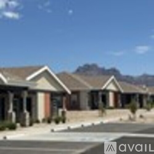 A row of houses with a clear blue sky above them.