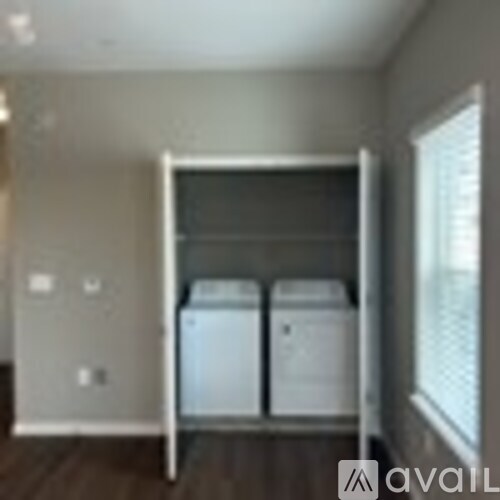 A laundry room with a washer and dryer in it.