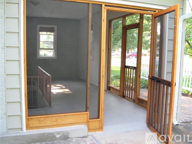 A glass door is open to a patio.