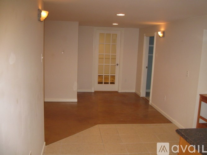 A room with a door and a table in it.