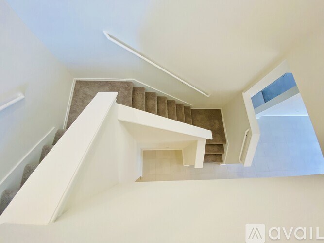 A staircase with a skylight above it.