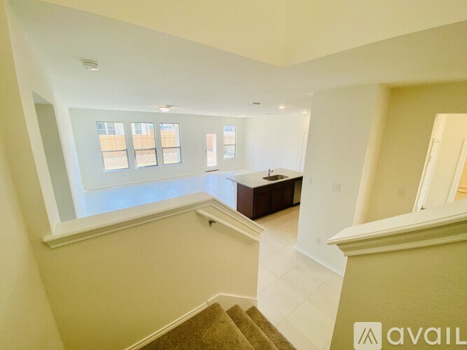 A room with a staircase leading to the second floor.