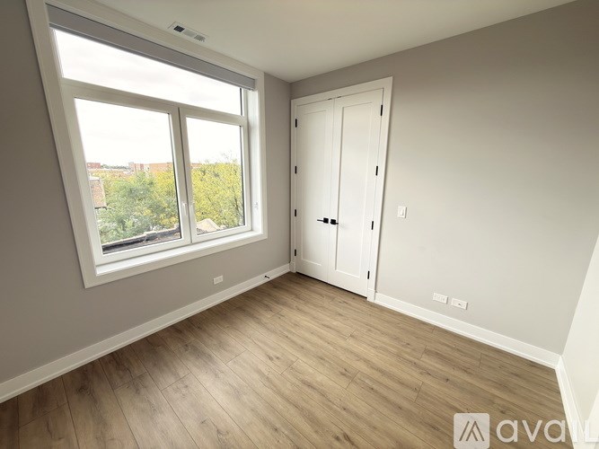 A room with a window and a door.