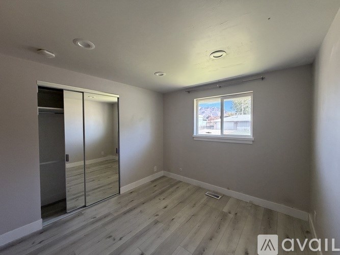 A room with a sliding glass door and a window.