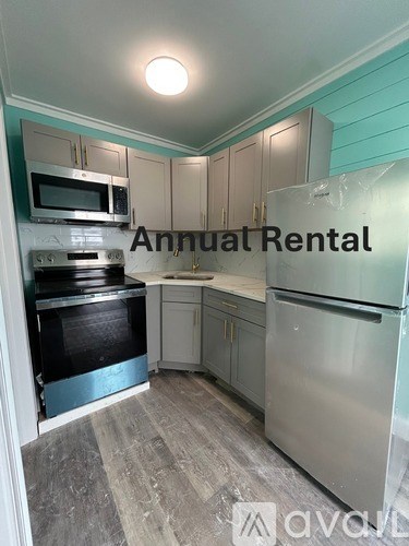 A kitchen with the words Annual Rental written on the wall.
