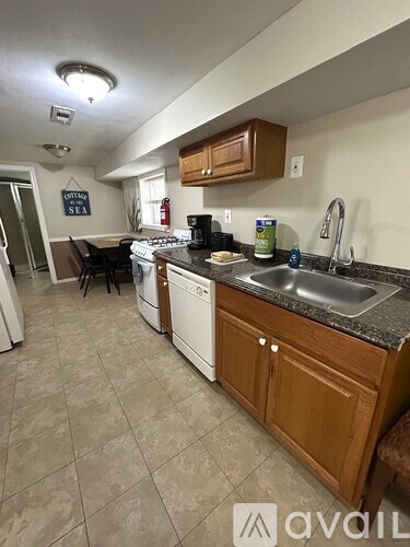 A kitchen with a washing machine and a dishwasher.