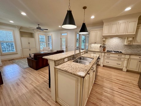 A kitchen with a sink and a counter.
