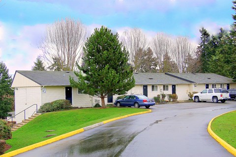 A car is parked in front of a building.