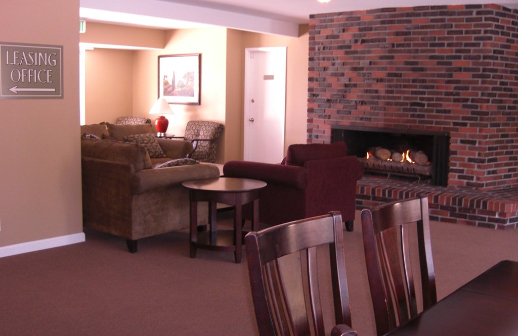 A living room with a fireplace and a couch.